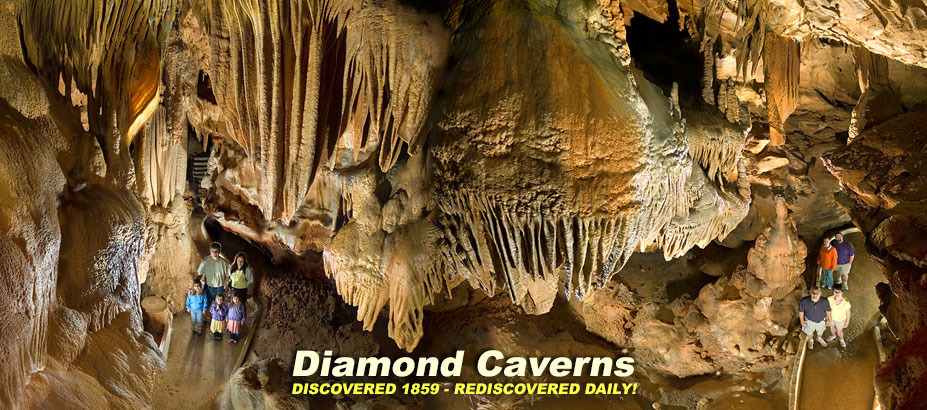 Diamond Caverns Cave Tour Scene. Flowing Drapery deposits showing scale with family and friends on the caves paved walkways.